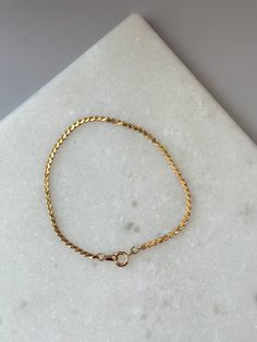 Add a touch of elegance to any outfit with the Kaylor Bracelet in Gold. Featuring a twisted gold chain, this bracelet adds a sophisticated and stylish touch. Perfect for any occasion, the Kaylor Bracelet will elevate your look and make you feel confident and glamorous. Dainty Gold Jubilee Bracelet, Adjustable Jubilee Snake Chain Bracelet, Adjustable Gold Plated Box Chain Bracelet, Elegant Gold Snake Chain Bracelets, Elegant Gold Bracelet With Snake Chain, Gold Braided Bracelet With Lobster Clasp As Gift, Minimalist Gold-tone Box Chain Bracelet, Elegant Gold Snake Chain Bracelet With Lobster Clasp, Gold Minimalist Box Chain Bracelet