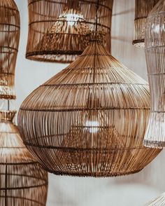 some brown wicker lamps hanging from the ceiling