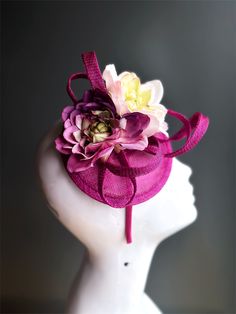 Featuring delicate flowers on a pink base, this fascinator hat adds a touch of romance and sophistication to any occasion. Lightweight and designed for a secure fit, allowing you to enjoy your masquerade event or tea party in comfort and style! Age Group/Gender - Adult/Women Size/Type - One size fits all adults Color - Pink Special Features - Flowers Flower-shaped Party Fascinator With Flower Decoration, Whimsical Flower-shaped Fascinator With Handmade Flowers, Whimsical Flower Costume Hats For Party, Elegant Flower Hair Accessories For Spring, Elegant Flower Headpieces For Spring, Elegant Spring Flower Hair Accessories, Pink Structured Crown Fascinator For Evening, Pink Fascinator For Kentucky Derby With Structured Crown, Pink Structured Crown Fascinator For Kentucky Derby