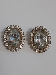 Very good condition with no stones missing Glamorous Evening Jeweled Clip-on Earrings, Glamorous Jeweled Clip-on Earrings For Evening, Formal Metal Crystal Earrings With Rhinestones, Formal Crystal Rhinestone Metal Earrings, Glamorous Jeweled Clip-on Earrings For Formal Events, Formal Crystal Rhinestone Earrings, Vintage Jeweled Clip-on Earrings For Evening, Glamorous Metal Clip-on Earrings, Glamorous Crystal Clip-on Earrings For Formal Events