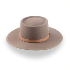 Description Materials Craftsmanship Hat Care Shipping Returns Product Description Taupe Brown Wide Brim Hat for Country Charm Embrace the spirit of the West with the Baron, a flat brim telescope cowboy hat crafted from premium bison fur felt. Designed for those who value tradition with a modern twist, this luxury hat features a unique telescope crown and a wide brim for maximum sun protection. Custom-fitted to your exact head measurements, The Baron offers a smooth finish, a grosgrain ribbon hat Mens Felt Hats, Cowboy Hat Crafts, Spanish Hat, Homburg Hat, Gambler Hat, Country Hats, Mens Hats Fashion, Fedora Hat Men, Luxury Hats