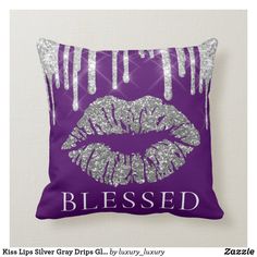 a blue pillow with silver glitter lips and the word diya on it's side