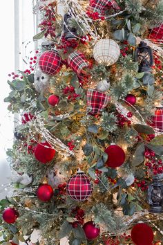 a christmas tree decorated with red, white and green ornaments