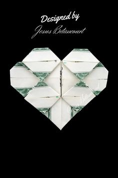 an origami heart made out of dollar bills on black background with the words designed by jeana reinenbergert