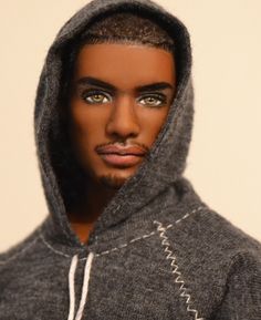 a close up of a person wearing a hoodie and looking at the camera with an intense look on his face