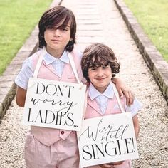 two children are holding signs that say don't worry ladies, we will single