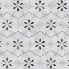 a white and black tile pattern with flowers on the bottom, in shades of gray