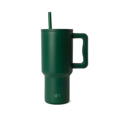 the green cup has a straw in it