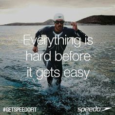 a man running in the water with a quote about everything is hard before it gets easy