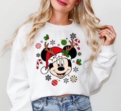 Mickey And Friends Christmas Sweatshirt, Christmas Sweater, Christmas Mickey Sweater, Christmas Party, Holiday Season, Christmas Gift Welcome to our cozy corner of comfort and style! We are thrilled to have you here at CozzyBoutigue, where every thread is woven with care and warmth. PRODUCT DETAILS Collar, shoulders, armholes, cuffs and hem double-needle stitched - 1 x 1 rib with spandex Features a crewneck - Relaxed fit - Unisex - 50% cotton 50% polyester HOW TO ORDER 1- Please review all photo Disney Christmas Sweatshirt, Cute Winter Mickey Mouse Sweatshirt, Disneyland Christmas Sweater, Mickey Christmas Sweater, White Christmas Holiday Sweatshirt, Playful Mickey Mouse Winter Tops, Vintage Mickey Christmas Shirts, Friend Christmas, Disney Christmas