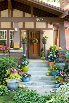 an instagram page with flowers and potted plants on the front steps in front of a house