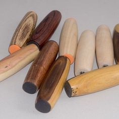 several wooden crayons lined up in a row