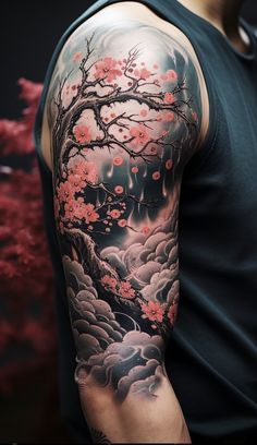 a man with a tattoo on his arm is standing in front of a cherry blossom tree