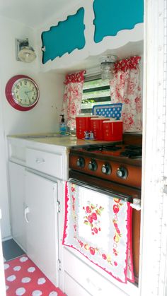 the kitchen is decorated in patriotic colors and has red, white, and blue decor