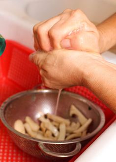 a person washing their hands in a sink