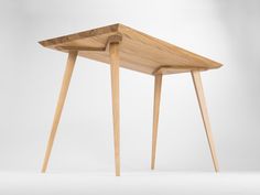 a wooden table with two legs and a triangle shaped design on the top, against a white background