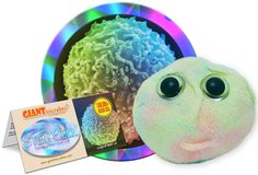 a stuffed animal next to a cd case with its eyes wide open and an eyeball in front of it