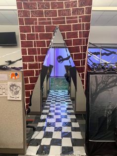 an open door to a room with a checkered floor