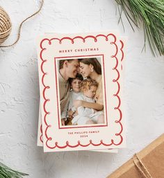 a christmas card with an image of a family on it