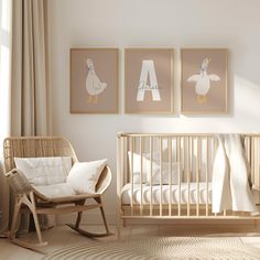 a baby's room with two pictures on the wall and a rocking chair next to it