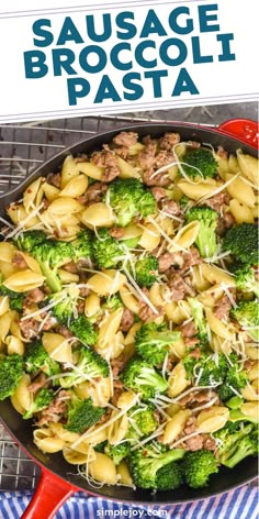 sausage and broccoli pasta in a skillet with text overlay that reads sausage broccoli pasta