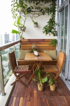 a wooden bench sitting on top of a wooden floor next to a table and chairs