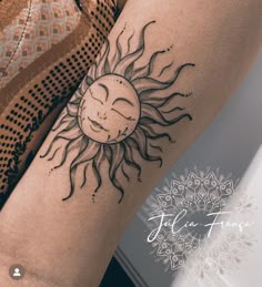 a woman's arm with a sun tattoo on it, and her face in the middle