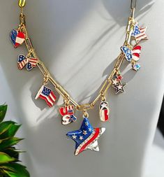 Celebrate Independence Day in style with this Custom Handmade Independence Day Charm Necklace. The chain  is made of Stainless Steel with 18 k Gold plating ,  16" in length with a 2" extender,  giving  18" of total length with a lobster claw closure. This necklace is a quality, durable piece that will not tarnish easily & is hypoallergenic making it a perfect accessory for those with sensitivities. The necklace features 9 charms, with a large star or heart charm as the center focal point.  This Patriotic Dangle Jewelry For Independence Day, Patriotic Nickel-free Jewelry For 4th Of July, Silver Jewelry Gift For 4th Of July, Silver Jewelry For 4th Of July Gift, Patriotic Dangle Jewelry For Gifts, Nickel Free Dangle Jewelry For 4th Of July, Patriotic Multicolor Dangle Jewelry, Patriotic Multicolor Necklaces For Gifts, Handmade Patriotic Jewelry For 4th Of July