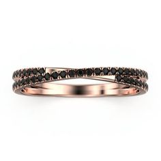 a rose gold wedding band with black diamonds