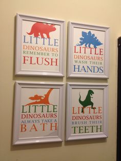 four little dinosaurs bathroom signs hung on the wall in a child's playroom