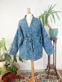 "Express Urgent Upgrade at Checkout only for Domestic Uk Pre Christmas Deliveries applicable for Mainland only until Friday 12 Noon .Elegant High Quality Extra Fine Kantha repurposed with handBlock Floral printing and then styled into Jacket Coat with pockets . Note : this is a light-mid weight jacket !! Matching piping detail all over to add definition on the reverse side . Each Piece is handcrafted with utmost attention to detail.  This Piece is reversible and is Gorgeous to be worn on the oth Blue Bohemian Outerwear With Pockets, Blue Long-sleeve Outerwear For Festivals, Blue Long Sleeve Outerwear For Festivals, Bohemian Cotton Outerwear In Indigo, Bohemian Indigo Long Sleeve Kimono, Bohemian Indigo Cotton Outerwear, Indigo Long Sleeve Bohemian Kimono, Blue Long-sleeved Cotton Kimono, Blue Cotton Long Sleeve Kimono