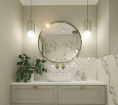 a bathroom with marble counter tops and white cabinets, along with a round mirror above the sink