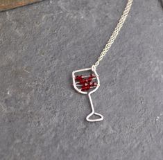 I'll have a glass of your finest red! Maybe you love the less-serious side of jewelry. Maybe you just love wine! I know I do. This hand-hammered necklace is sure to bring smiles and conversation wherever you go. Tiny Swarovski crystal beads strung on sterling silver wire stand in for your favorite red. The pendant is approximately 0.5 inches wide and approximately 1.25 inches long. Choose your chain length, or leave a note to seller if you would like a chain length other than those listed. All i Sterling Silver Necklace For Valentine's Day Party, Silver Necklaces For Mother's Day Party, Mother's Day Party Sterling Silver Necklace, Silver Necklace Party Gift, Silver Necklace For Party Or Gift, Silver Necklace For Party And Gift, Silver Necklace For Party Or As A Gift, Silver Necklaces For Valentine's Day Celebration, Nickel Free Jewelry For Mother's Day Party