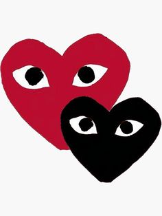 two red and black hearts with eyes drawn on them