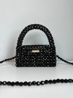 KNITKOS black bag, beaded bag, mini purse, acrylic black bag, woman handbag, shoulders bag, crossbody bag, luxury clutch, handmade purse This model can FITS :  - Any IPhone ( except PRO MAX ) upon request, I can enlarge this bag for your IPhone without any additional fees, when placing an order in the comments, just write your IPhone model ❣️🫶🏻 - flat  - car keys ID  - driver's license  - headphones / AirPods  - cardholder  - cash lipstick  - antiseptic Dimensions - Width: (20cm) - Height: (18 Black Evening Bag With Mobile Phone Holder, Luxury Black Beaded Evening Bag, Handmade Black Evening Bag, Black Handmade Evening Bag For Party, Gift Black Beaded Shoulder Bag, Black Clutch For Party With Mobile Phone Bag, Black Square Evening Bag As Gift, Black Beaded Evening Bag As Gift, Black Beaded Evening Bag For Gift