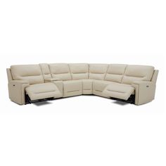 a white leather sectional sofa with reclinings