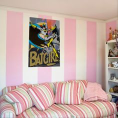 a pink and white striped living room with an ice cream sundae on the wall