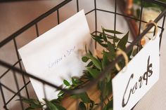 a plant in a wire basket with a note attached to the side that says, happy father's day