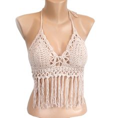 a mannequin wearing a halter top with crocheted fringes on it