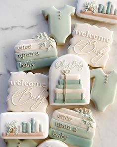 decorated cookies with welcome baby signs on them