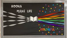 a bulletin board with books made life written on it and colorful streamers coming out of the book