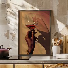 a person holding a wine glass in front of a wall with plates and utensils