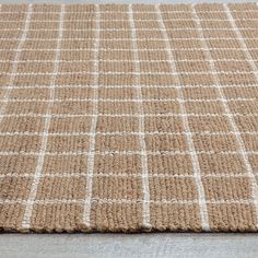 a brown and white rug on the floor