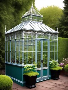 a small green house sitting in the middle of a garden