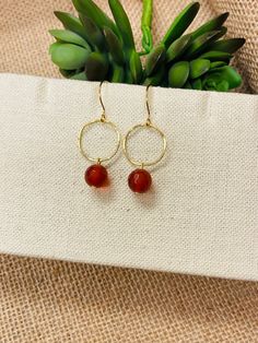 "These beautiful earrings are made with faceted orange Carnelian gemstone beads that dangle from simple gold hoops. The ear wires are hypoallergenic, gold finished brass. They hang about 1 3/4 inches. They are lightweight and a perfectly subtle way to complete your look. Need this gift wrapped? Add that here: https://www.etsy.com/jejewelry/listing/1309835402/holiday-gift-wrapping-add-on-ready-to?utm_source=Copy&utm_medium=ListingManager&utm_campaign=Share&utm_term=so.lmsm&share_time=166620147227 Simple Beaded Earrings, Simple Gold Hoops, Virgo Birthstone, Earrings Gold Hoops, Elizabeth Jewelry, Carnelian Earrings, Orange Carnelian, Gemstone Beads Jewelry, July Birthday