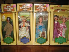 three dolls are in the same box