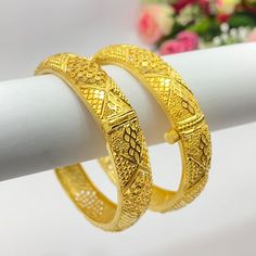 22k Gold Plated Openable Bangles/Kangan/kare/Bridal Indian Jewelry Wedding Jewellery It is a perfect match with formal attire on special occasions or with casual wearing Care instructions Keep Jewellery away from direct heat, water, perfumes, deodorants and other strong chemicals as they may react with the metal or plating. The plating composition of Jewellery is as such that  perspiration (sweat) will not damage it. Wipe Jewellery gently with chamois cloth or leather swatch after every use. Wiping the jewellery with a soft cloth after removing the jewellery would add to its life. Avoid water  exposure for all jewelry  Thank You For Visiting Marriage Bangle With Intricate Design, Elegant Bridal Sets For Marriage During Diwali, Gold Chandbali Bridal Set For Marriage, Wedding Bangle Openable, Elegant Gold Bridal Set For Eid, Bollywood Style Bridal Sets With Intricate Design, Bollywood Bridal Sets With Intricate Design For Wedding, Gold Traditional Wedding Wear, Gold Traditional Wear For Eid Wedding