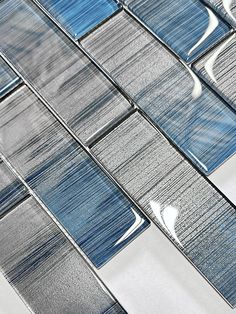 blue and white glass tile with water reflections on it's surface, as seen from above