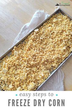 a tray filled with freeze dry corn on top of a wooden table