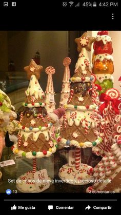 a display case with many different types of christmas trees and candy canes on it